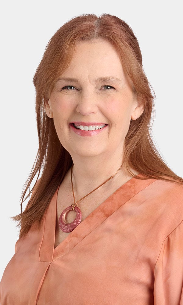 Model showing off a necklace made with resin